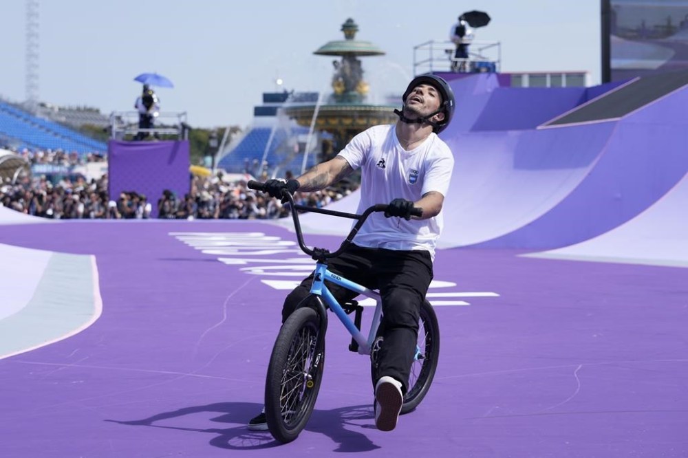 Gil Jose Torres, of Argentina, reacts after finishing his second run of the cycling BMX freestyle women's park final at the 2024 Summer Olympics, Wednesday, July 31, 2024, in Paris, France. (AP Photo/Frank Franklin II)