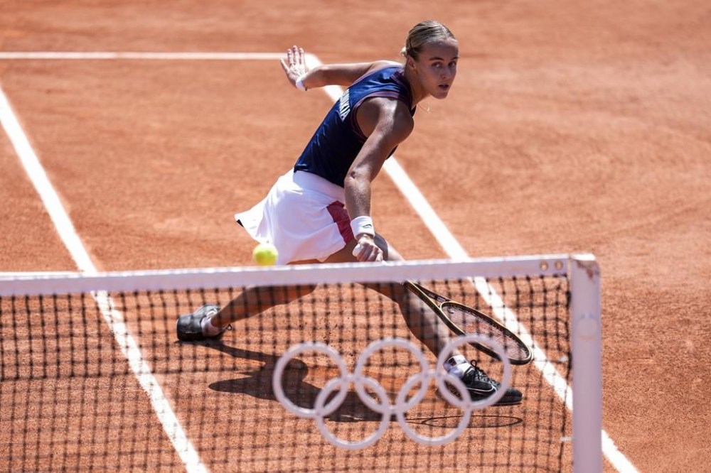 Anna Karolina Schmiedlova of Slovakia returns the ball against Barbora Krejcikova of Czech Republic during the women's single tennis competition at the Roland Garros stadium, at the 2024 Summer Olympics, Wednesday, July 31, 2024, in Paris, France. (AP Photo/Manu Fernandez)