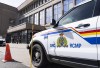 RCMP say a father and son facing terrorism related charges were allegedly in the advanced stages of planning a serious, violent attack in Toronto. An RCMP logo is shown on a vehicle in Montreal, March 7. THE CANADIAN PRESS/Christinne Muschi