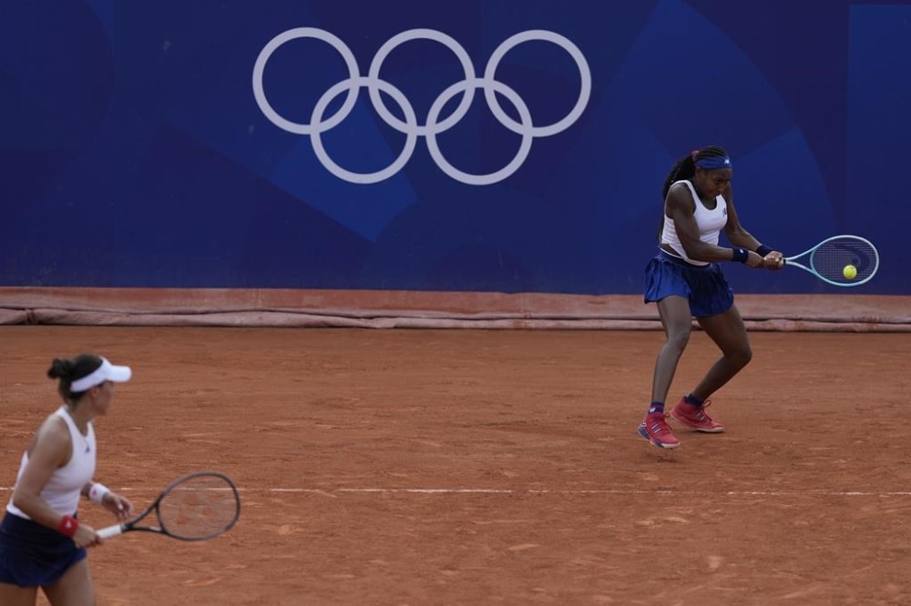 Coco Gauff and Jessica Pegula of the United States play Linda Noskova and Karolina Muchova of the Czech Republic during their women's doubles match, at the 2024 Summer Olympics, Wednesday, July 31, 2024, at the Roland Garros stadium in Paris, France. (AP Photo/Andy Wong)