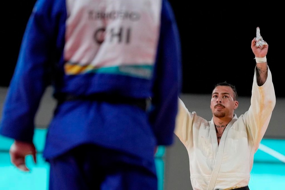 Canada's Shady Elnahas celebrates his win over Chile's Thomas Briceno during the men's 100kg judo gold medal match at the Pan American Games, in Santiago, Chile, Saturday, Oct. 21, 2023. Elnahas will be in action in the men's 100-kilogram elimination Round of 16. THE CANADIAN PRESS/Frank Gunn