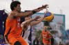 Dimeo van der Horst of the Netherlands, left, vies with Latvia's Zigmars Raimo in the men's 3x3 basketball pool round match between Latvia and the Netherlands at the 2024 Summer Olympics, Wednesday, July 31, 2024, in Paris, France. (AP Photo/Rebecca Blackwell)