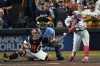 FILE - Atlanta Braves' Jorge Soler hits a three-run home run during the third inning in Game 6 of baseball's World Series between the Houston Astros and the Atlanta Braves Tuesday, Nov. 2, 2021, in Houston. The Braves would love to see him recreate that magic as they prepare for another postseason run by continuing to reunite members of that championship team. (AP Photo/Sue Ogrocki, File)