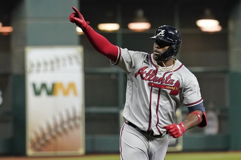 FILE - Atlanta Braves' Jorge Soler celebrates a three-run home run during the third inning in Game 6 of baseball's World Series between the Houston Astros and the Atlanta Braves Tuesday, Nov. 2, 2021, in Houston. The Braves would love to see him recreate that magic as they prepare for another postseason run by continuing to reunite members of that championship team. (AP Photo/Eric Gay, File)