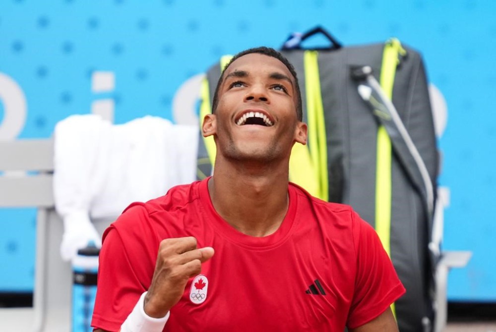 Felix Auger-Aliassime of Canada celebrates his win over Daniil Medvedev of AIN during third round in the men's singles at the 2024 Summer Olympics in Paris, France on Tuesday, July 30, 2024. THE CANADIAN PRESS/Christinne Muschi