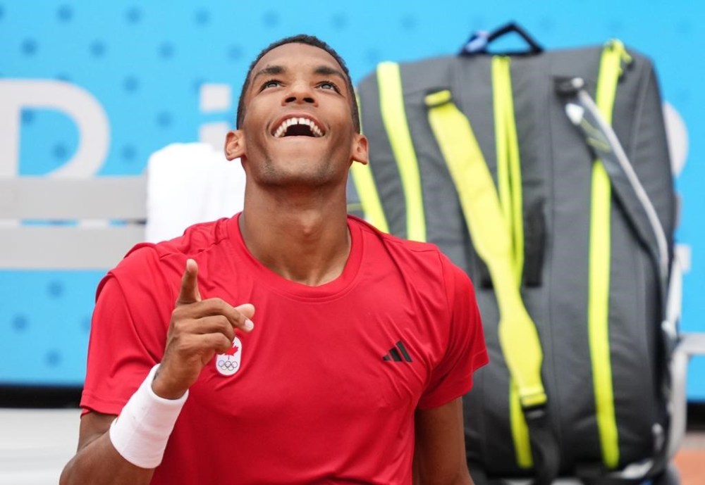 Felix Auger-Aliassime of Canada celebrates his win over Daniil Medvedev of AIN during third round in the men's singles at the 2024 Summer Olympics in Paris, France on Tuesday, July 30, 2024. THE CANADIAN PRESS/Christinne Muschi