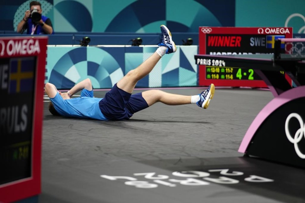 Sweden's Truls Moregrad reacts after his win against China's Wang Chuqin in a men's singles round of 32 table tennis game at the 2024 Summer Olympics, Wednesday, July 31, 2024, in Paris, France. (AP Photo/Petros Giannakouris)