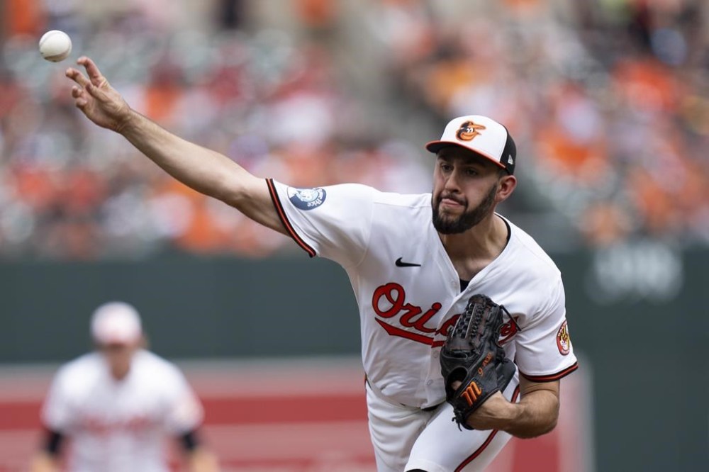 Baltimore Orioles starting pitcher Grayson Rodriguez delivers during the first inning of a baseball game against the Toronto Blue Jays, Wednesday, July 31, 2024, in Baltimore. (AP Photo/Stephanie Scarbrough)