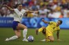 Australia's Katrina Gorry, right, challenges United States' Samantha Coffey during a women's Group B soccer match between Australia and the United States, at the Marseille Stadium, at the 2024 Summer Olympics, Wednesday, July 31, 2024, in Marseille, France. (AP Photo/Daniel Cole)
