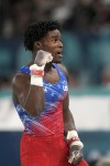 Frederick Richard, of the United States, celebrates after performing on the horizontal bar during the men's artistic gymnastics all-around finals in Bercy Arena at the 2024 Summer Olympics, Wednesday, July 31, 2024, in Paris, France. (AP Photo/Charlie Riedel)