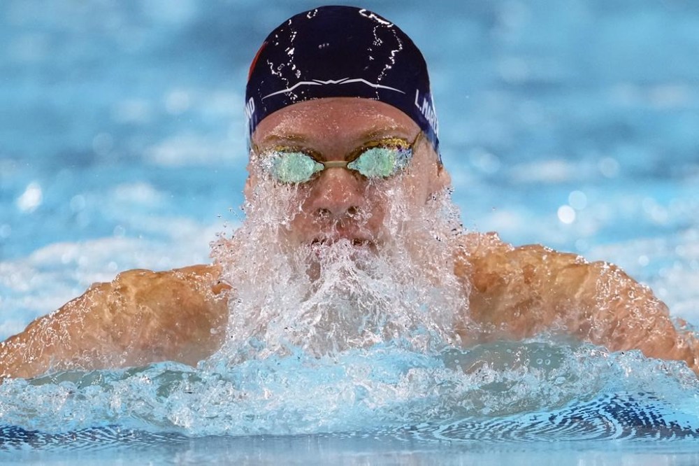 Leon Marchand, of France, competes in the men's 200-meter breaststroke final at the 2024 Summer Olympics, Wednesday, July 31, 2024, in Nanterre, France. (AP Photo/Matthias Schrader)