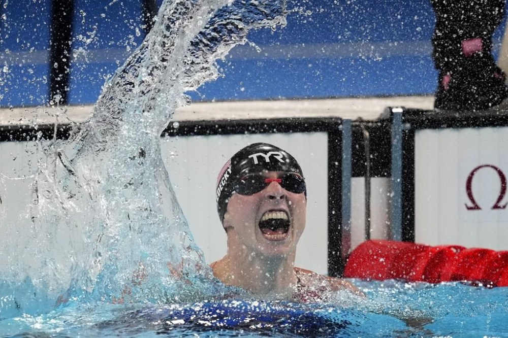 Katie Ledecky, of the United States, celebrates after winning the women's 1500-meter freestyle final at the 2024 Summer Olympics, Wednesday, July 31, 2024, in Nanterre, France. (AP Photo/Petr David Josek)