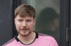 FILE - Jimmy Donaldson, the YouTube star known as MrBeast, stands in a sideline box at an MLS soccer match on March 10, 2024, in Fort Lauderdale, Fla. MrBeast, YouTube's biggest star and a philanthropic force with nearly unrivaled influence among young audiences, admitted Wednesday, July 31, 2024, that he used inappropriate language in his early online days. (AP Photo/Rebecca Blackwell, File)