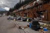 Piles of belongings line the curb, as part of emergency fire-smarting efforts to save structures in Jasper, Alta., after a wildfire devastated the community on July 26, 2024. THE CANADIAN PRESS/Amber Bracken