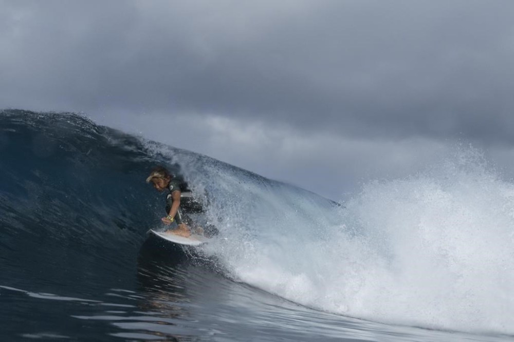 Liam Sham Koua, 11, surfs his home shore break during a break in the 2024 Summer Olympics surfing competition, Wednesday, July 31, 2024, in Teahupo'o, Tahiti. While Teahupo'o has been a coveted destination for surfers from around the world for decades, it's only in more recent years that local surf culture and talent has begun to develop across Tahiti. (AP Photo/Gregory Bull)