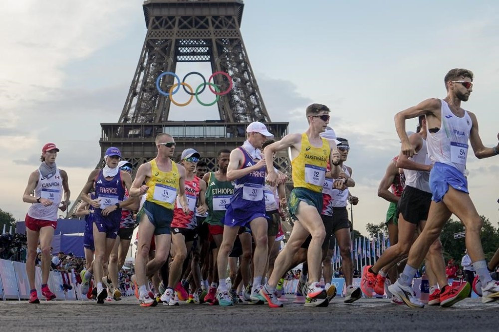 Canada's Evan Dunfee (18), France's Aurelien Quinion (38), Australia's Declan Tingay (14), France's Gabriel Bordier (37), Australia's Kyle Swan (12) and Italy's Riccardo Orsoni (54) compete during the men's 20km race walk at the 2024 Summer Olympics, Thursday, Aug. 1, 2024, in Paris, France. THE CANADIAN PRESS/AP /Vadim Ghirda