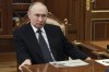 Russian President Vladimir Putin listens to the head of the Republic of Mordovia Artem Zdunov during their meeting at the Kremlin in Moscow, Russia, Thursday, Aug. 1, 2024. (Gavriil Grigorov, Sputnik, Kremlin Pool Photo via AP)