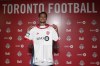 Newly-signed American defender Henry Wingo shows off his Toronto FC jersey at the MLS club’s club training centre in Toronto on Wednesday, July 31, 2024. THE CANADIAN PRESS/Neil Davidson