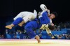 Canada's Shady Elnahas, top, competes against Switzerland's Daniel Eich during the Men's 100 Kg Judo at the Paris Summer Olympics in Paris, France on Thursday, August 1, 2024. Elnahas lost the match. THE CANADIAN PRESS/Nathan Denette