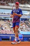 Tommy Paul, of United States prepares to serve against Carlos Alcaraz of Spain during their men's quarter-final match at the Roland Garros stadium, at the 2024 Summer Olympics, Thursday, Aug. 1, 2024, in Paris, France. (AP Photo/Manu Fernandez)