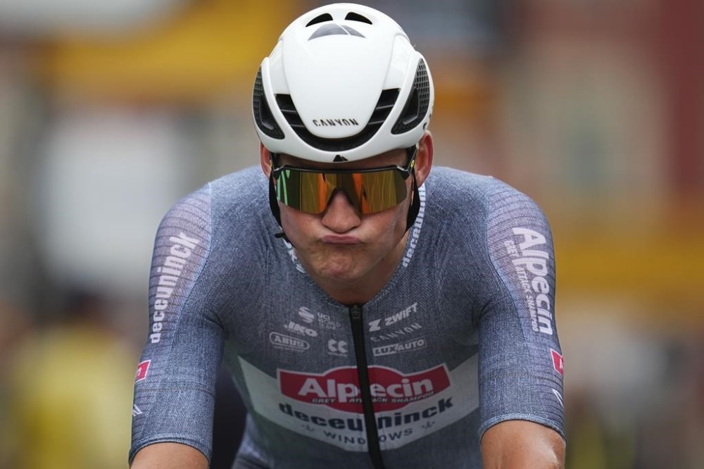 Netherlands' Mathieu van der Poel reacts after crossing the finish line of the twenty-first stage of the Tour de France cycling race, an individual time trial over 33.7 kilometers (20.9 miles) with start in Monaco and finish in Nice, France, Sunday, July 21, 2024. (AP Photo/Daniel Cole)