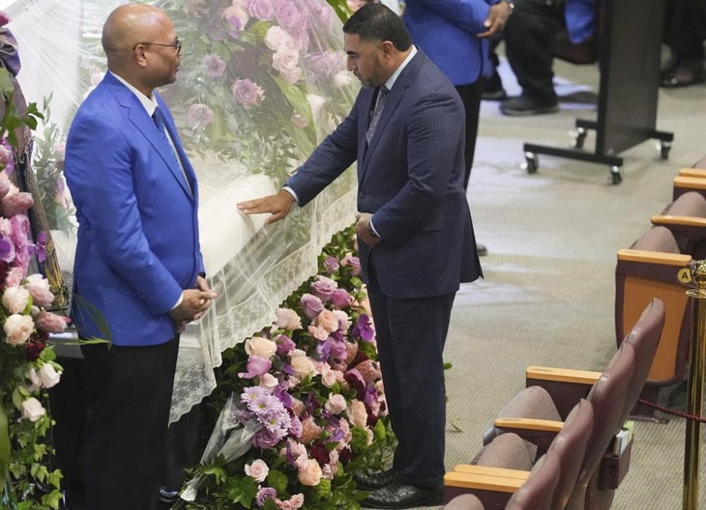 Texas Rep. Armando Walle touches the casket of the late Congresswoman Sheila Jackson Lee during her viewing and remembrance at God's Grace Community Church on Tuesday, July 30, 2024 in Houston. (Elizabeth Conley/Houston Chronicle via AP)