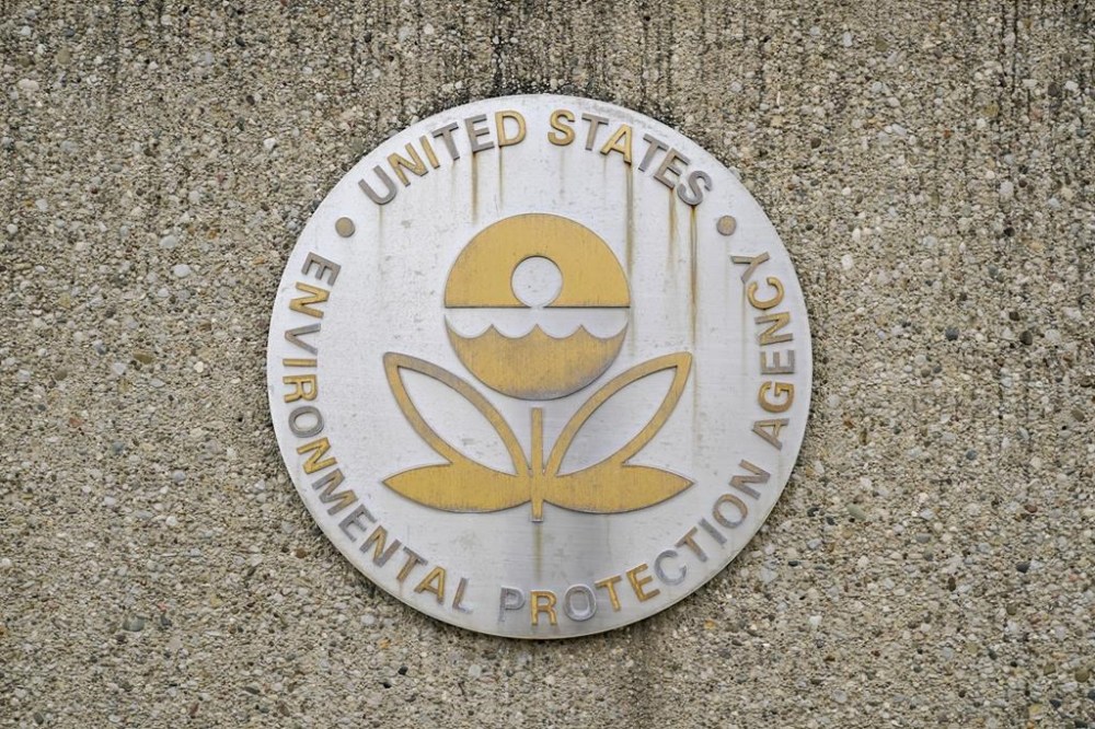 FILE - A U.S. Environmental Protection Agency sign is seen outside the Andrew W. Breidenbach Environmental Research Center, Feb. 17, 2023, in Cincinnati. The EPA is issuing an emergency fuel waiver to help alleviate shortages in four Midwest states were gasoline supplies are in short supply after the shutdown of an refinery in Illinois. (AP Photo/Joshua A. Bickel, File)