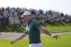Rory McIlroy, of Ireland, acknowledges the crowd as he walks to the 1st tee, prior to playing, during the first round of the men's golf event at the 2024 Summer Olympics, Thursday, Aug. 1, 2024, at Le Golf National in Saint-Quentin-en-Yvelines, France. (AP Photo/George Walker IV)