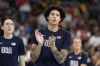 United States' Brittney Griner, center, stands on the court prior to a women's basketball game against Belgium at the 2024 Summer Olympics, Thursday, Aug. 1, 2024, in Villeneuve-d'Ascq, France. (AP Photo/Michael Conroy)