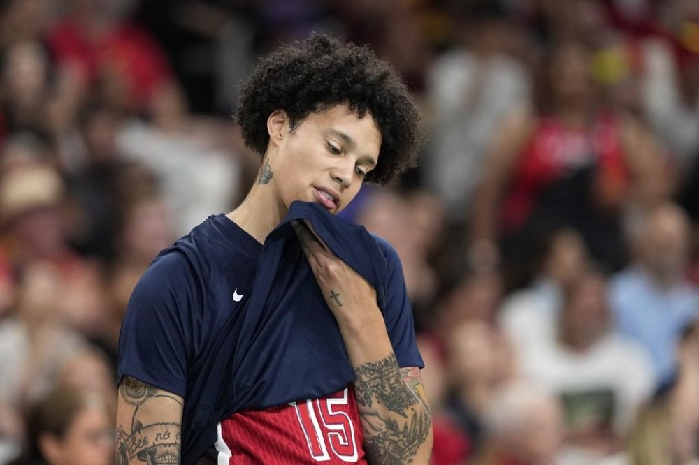 United States' Brittney Griner, center, stands on the court prior to a women's basketball game against Belgium at the 2024 Summer Olympics, Thursday, Aug. 1, 2024, in Villeneuve-d'Ascq, France. (AP Photo/Michael Conroy)