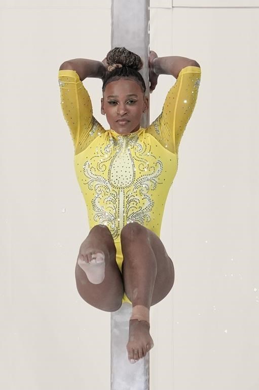 Rebeca Andrade, of Brazil, performs on the balance beam during the women's artistic gymnastics all-around finals in Bercy Arena at the 2024 Summer Olympics, Thursday, Aug. 1, 2024, in Paris, France. (AP Photo/Morry Gash)