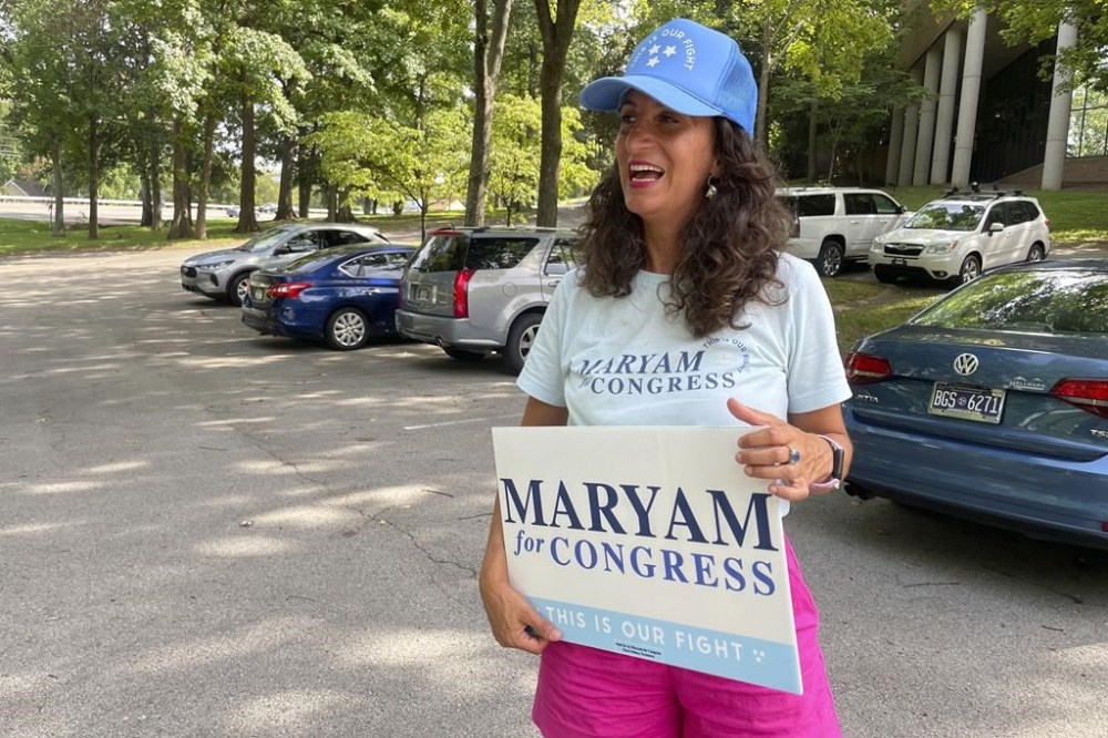 Democratic congressional candidate Maryam Abolfazli greets voters on primary election day, Thursday, Aug. 1, 2024, at the Christ Church Nashville polling place in Nashville, Tenn. Abolfazli is unopposed in the Democratic primary for Congressional District 5. (AP Photo/Jonathan Mattise)