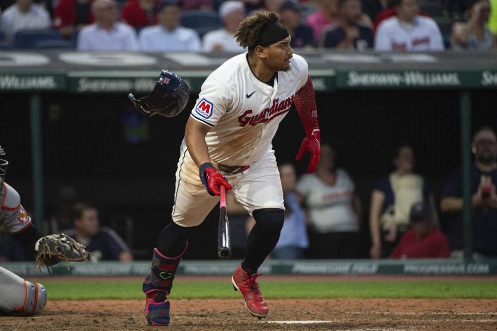 Cleveland Guardians' Josh Naylor heads to first base after hitting a single off Baltimore Orioles relief pitcher Albert Suarez during the seventh inning of a baseball game in Cleveland, Thursday, Aug. 1, 2024. (AP Photo/Phil Long)