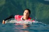 Brazil's Luana Silva paddles back to the line up during the quarterfinals of the 2024 Summer Olympics surfing competition, Thursday, Aug. 1, 2024, in Teahupo'o, Tahiti. (Ben Thouard/Pool Photo via AP)