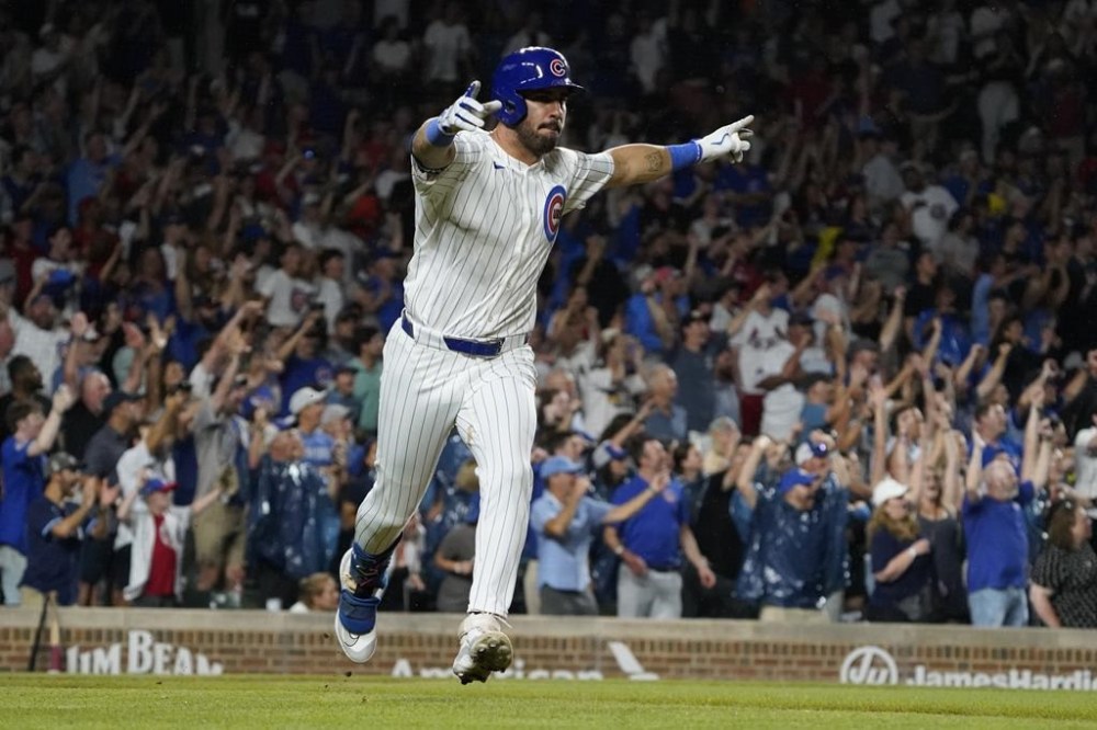 Chicago Cubs pinch hitter Mike Tauchman reacts after hitting a walkoff single against the St. Louis Cardinals during the ninth inning of a baseball game Thursday, Aug. 1, 2024, in Chicago. (AP Photo/David Banks)