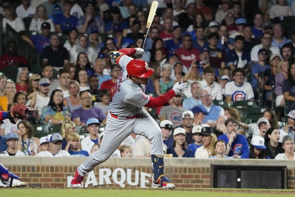 St. Louis Cardinals' Nolan Arenado hits a one-run single against the Chicago Cubs during the seventh inning of a baseball game Thursday, Augu. 1, 2024, in Chicago. (AP Photo/David Banks)