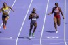 Sha'carri Richardson of the United States, wins a heat in the women's 100-meter run at the 2024 Summer Olympics, Friday, Aug. 2, 2024, in Saint-Denis, France. (AP Photo/Martin Meissner)