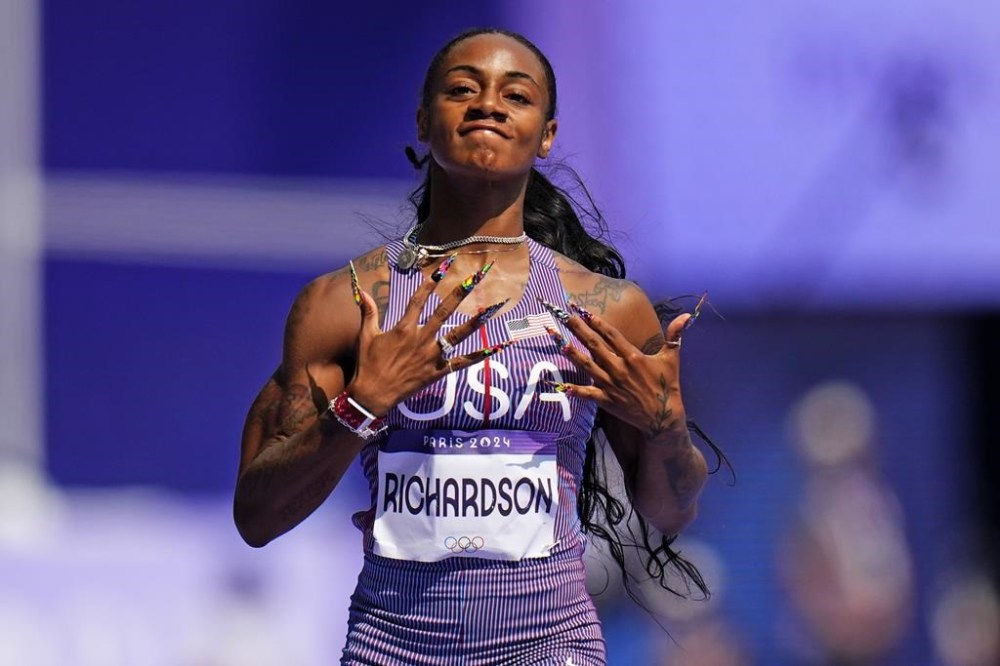 Sha'carri Richardson of the United States, wins a heat in the women's 100-meter run at the 2024 Summer Olympics, Friday, Aug. 2, 2024, in Saint-Denis, France. (AP Photo/Petr David Josek)