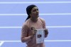 Kimia Yousofi, of Afghanistan, makes a political statement after a heat in the women's 100-meter run at the 2024 Summer Olympics, Friday, Aug. 2, 2024, in Saint-Denis, France. (AP Photo/Martin Meissner)