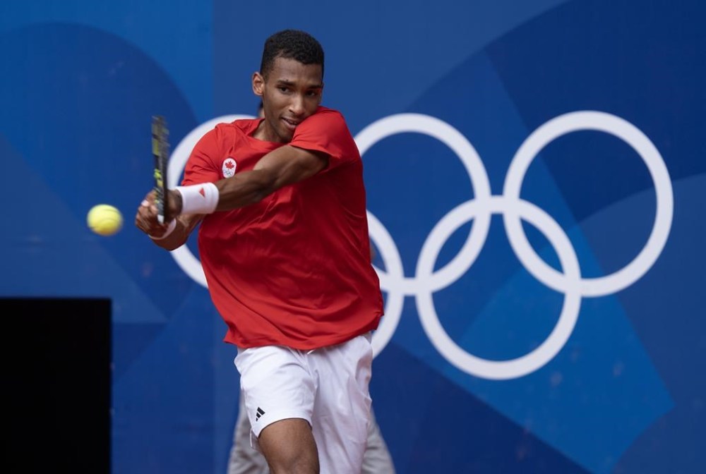 Felix Auger-Aliassime plays against Spain's Carlos Alcaraz during a men's tennis semifinal at the Summer Olympics, Friday, August 2, 2024 in Paris. THE CANADIAN PRESS/Adrian Wyld