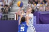 CAPTION CORRECTS ID Dearica Hamby, of the United States, shoots over Marie Eve Paget (5), of France, in the women's 3x3 basketball pool round match during the 2024 Summer Olympics, Friday, Aug. 2, 2024, in Paris, France. The United States won 14-13. (AP Photo/Frank Franklin II)