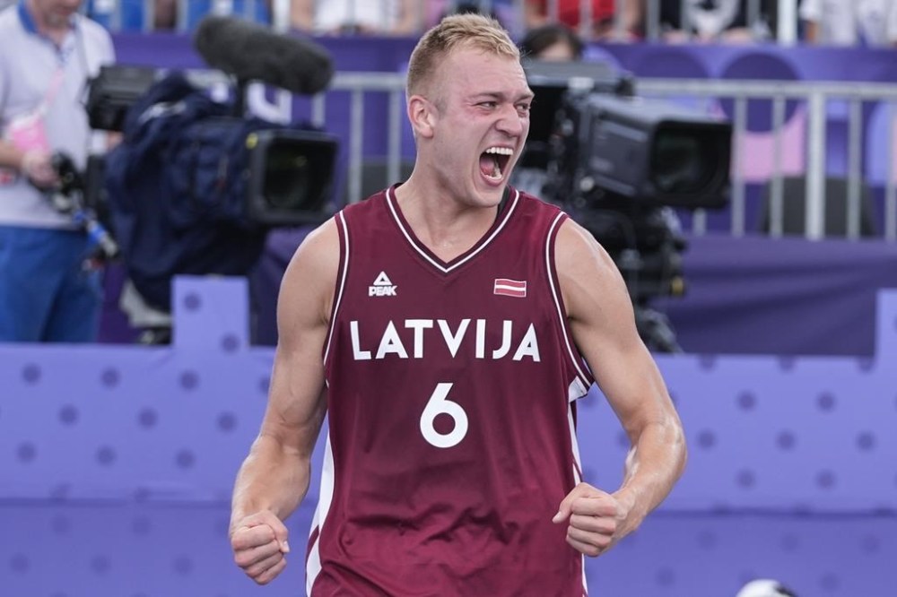 Latvia's Francis Lacis (6) celebrates after a men's 3x3 basketball pool round match against France during the 2024 Summer Olympics, Friday, Aug. 2, 2024, in Paris, France. Latvia won 22-20. (AP Photo/Frank Franklin II)