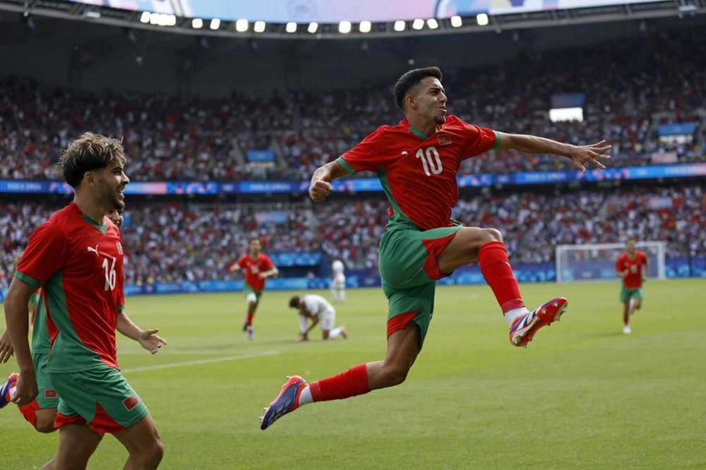 Morocco's Ilias Akhomach celebrates scoring his side's second goal during the quarterfinal men's soccer match between Morocco and the United States at the Parc des Princes during the 2024 Summer Olympics, Friday, Aug. 2, 2024, in Paris, France. (AP Photo/Aurelien Morissard)