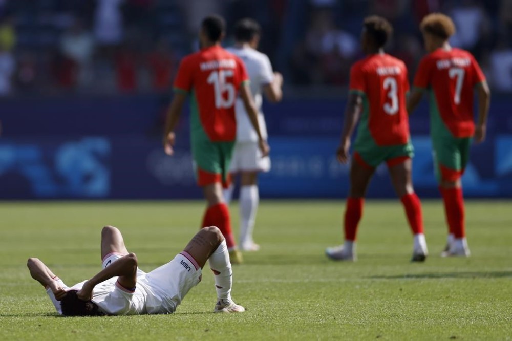 Nathan Harriel of the United States reacts after losing 4-0 in the quarterfinal men's soccer match between Morocco and the United States at the Parc des Princes during the 2024 Summer Olympics, Friday, Aug. 2, 2024, in Paris, France. (AP Photo/Aurelien Morissard)