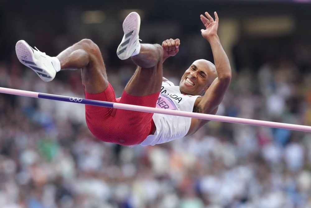 Canada's Damian Warner competes in the high jump in the men's decathlon at the Paris Summer Olympics in Paris, France on Friday, August 2, 2024. THE CANADIAN PRESS/Nathan Denette