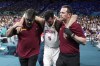 Spain's Rudy Fernandez, center, is held off the court after being injured in a men's basketball game against Greece at the 2024 Summer Olympics, Tuesday, July 30, 2024, in Villeneuve-d'Ascq, France. (AP Photo/Michael Conroy)