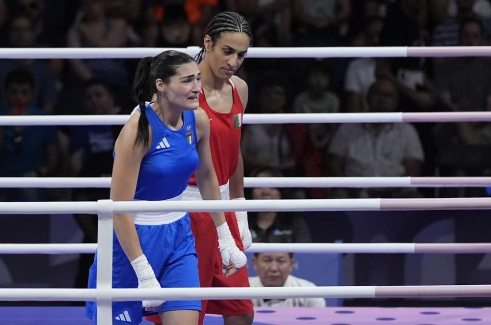 Algeria's Imane Khelif, right, defeated, Italy's Angela Carini in their women's 66kg preliminary boxing match at the 2024 Summer Olympics, Thursday, Aug. 1, 2024, in Paris, France. (AP Photo/Ariana Cubillos)