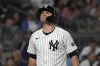 New York Yankees' J.D. Davis reacts after striking out during the sixth inning of a baseball game against the New York Mets, Wednesday, July 24, 2024, in New York. (AP Photo/Pamela Smith)