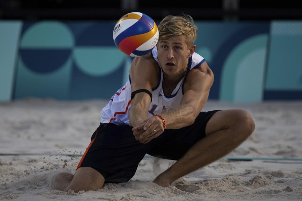 Netherlands' Steven Van De Velde hits the ball during the men's pool B beach volleyball match between Norway and Netherlands at Eiffel Tower Stadium at the 2024 Summer Olympics, Friday, Aug. 2, 2024, in Paris, France. (AP Photo/Louise Delmotte)