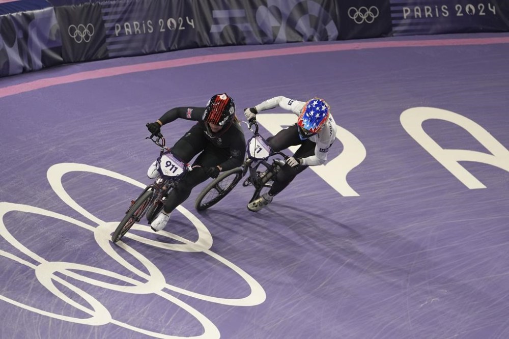 Bethany Shriever of Britain leads Alise Willoughby of the United States during a BMX racing event, at the 2024 Summer Olympics, Friday, Aug. 2, 2024, in Saint-Quentin-en-Yvelines, France. (AP Photo/Thibault Camus)